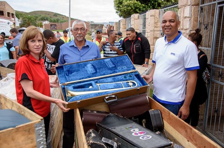 Annemarie Viljoen (Operations Manager, WE Deane SA), Faizal de Doncker (Material Planning and Logistics Manager, Ford Struandale Engine Plant) and Alton September (founder and rector of the Mandela Metro School of Arts) inspect the seven crates, weighing in at 425 kg, packed full of donated musical instruments from Norway, estimated to be worth over R650 000.