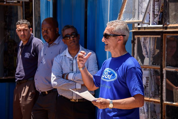 Hyron Muniz (Production Manager at the Ford Struandale Engine Plant, and project lead for the Vastrap container housing project) launches the second phase of the initiative, comprising five additional converted container housing units and a multi-purpose community centre.