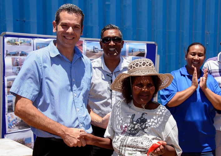 Lindley Ntlanjeni was the first recipient of a housing unit in the second phase of the Vastrap container project, receiving the key from Neil Stander (left), Programs and Engineering Manager at the Ford Struandale Engine Plant, along with Basil Raman (Operations Manager, Ford Struandale Engine Plant) and Erika Potberg, social worker from the Human Settlements Department at the Nelson Mandela Bay Municipality.