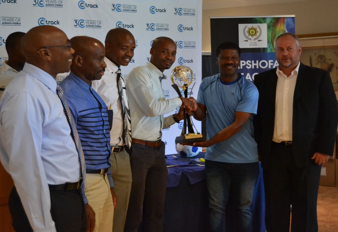 2.Jerry Sikhosana handing over SAPSHOFA League trophy to SAPS members