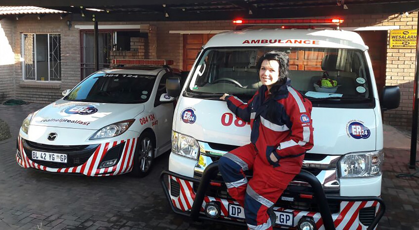 Charne Language, based at ER24 Rustenburg, with two of the vehicles you can expect to see on the road. 